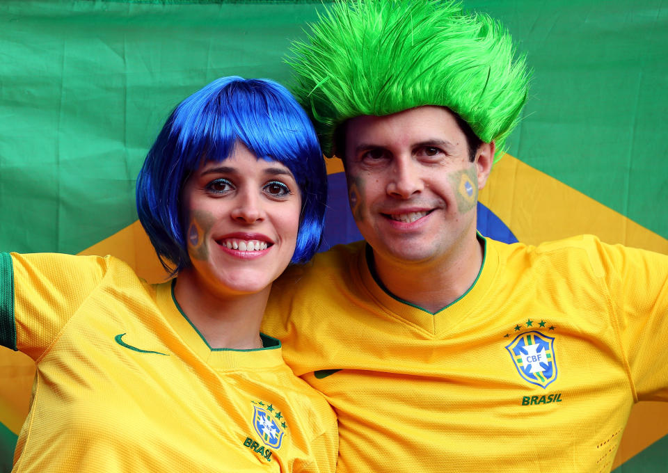 MANCHESTER, ENGLAND - AUGUST 07: Brazilian fans show support during the Men's Football Semi Final match between Korea and Brazil, on Day 11 of the London 2012 Olympic Games at Old Trafford on August 7, 2012 in Manchester, England. (Photo by Stanley Chou/Getty Images)
