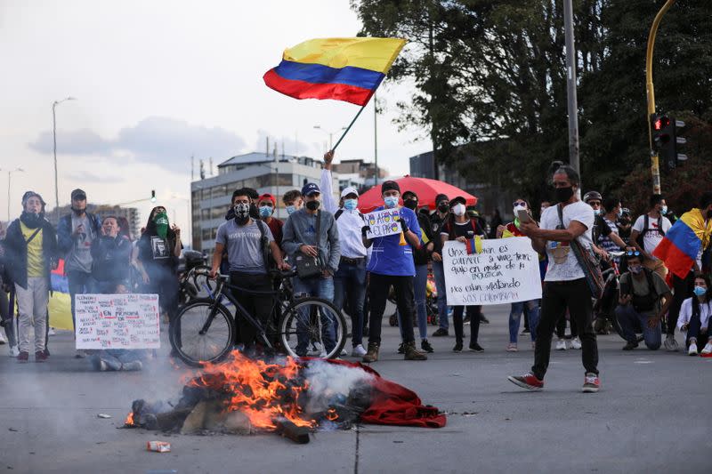 Demonstrators take part in a protest, in Bogota