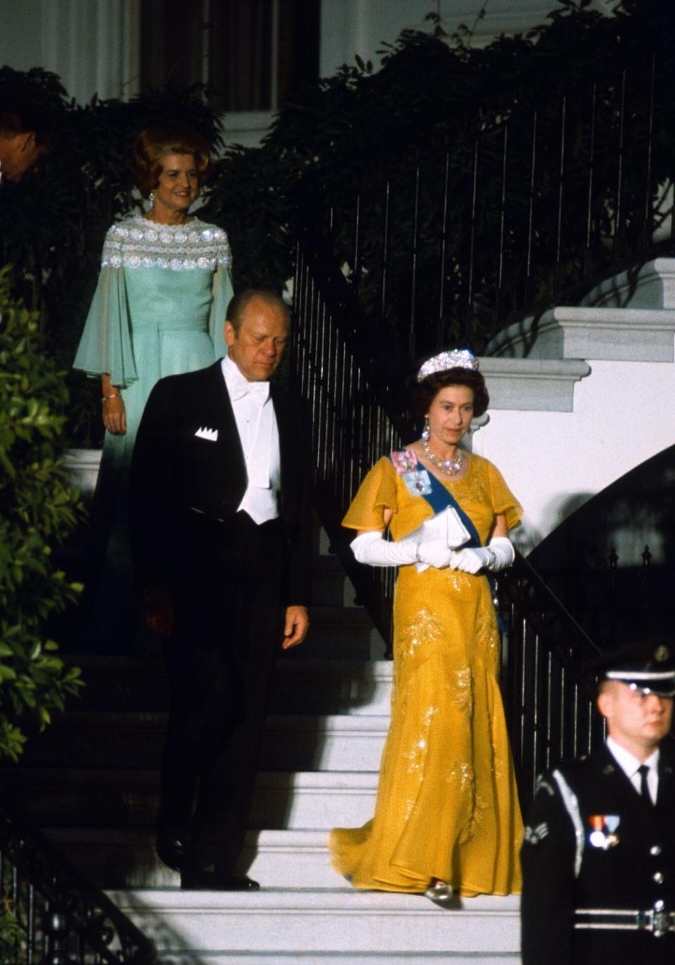 <p>During a state visit in Washington, D.C., Queen Elizabeth wore this bright yellow design for a formal dinner with President Ford. </p>