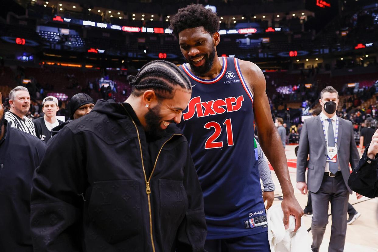 Joel Embiid #21 of the Philadelphia 76ers greets Canadian rapper Drake after the game against the Toronto Raptors during Round 1 Game 3 of the 2022 NBA Playoffs on April 20, 2022 at the Scotiabank Arena in Toronto, Ontario, Canada.