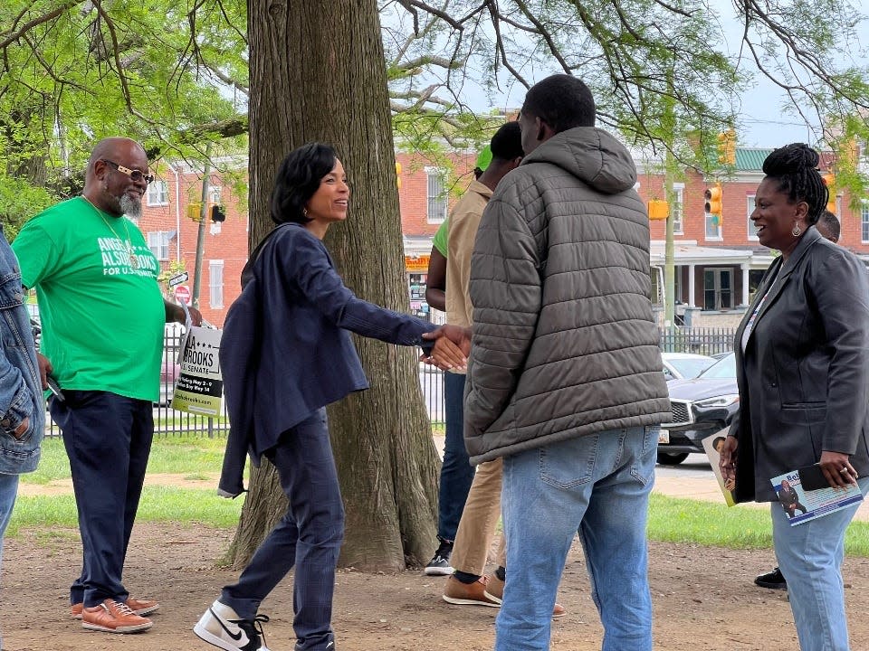 Prince George's County Executive Angela Alsobrooks, a Democratic candidate for United States Senate, greets a prospective voter outside Green Street Academy in Baltimore, Maryland on the primary Election Day May 14, 2024.