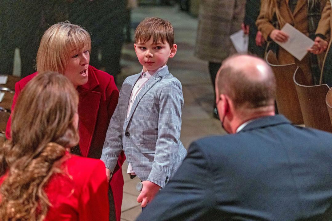 RETRANSMISSION, adding name of participants. The Duke and Duchess of Cambridge talk to Tony Hudgell, seven, with his adoptive mother Paula Hudgell, from King's Hill, Kent, ahead of the Together At Christmas community carol service at Westminster Abbey in London. Picture date: Wednesday December 8, 2021.