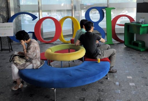 This file photo shows visitors sitting at a lobby of Google Korea office in Seoul, in 2010. Google has confirmed that its online search and advertising services are under scrutiny by regulators in Argentina and S.Korea