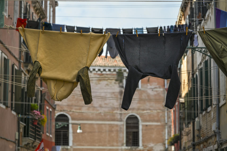 clothes drying on clothes lines hung up between buildings