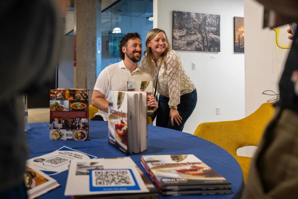 Benjy Engel signs cook books at the Sacramento Bee’s News and Nosh event following a talk with The Rind’s Sara Arbabian on June 25.