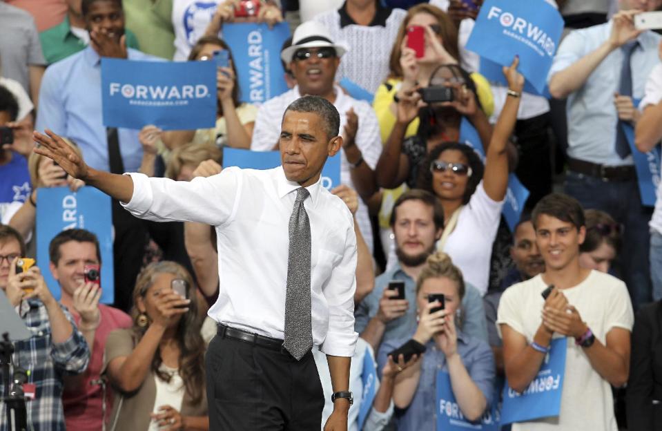 President Barack Obama waves to supporters after speaking at a campaign event at Schiller Park Monday, Sept. 17, 2012, in Columbus, Ohio. (AP Photo/Tony Dejak)
