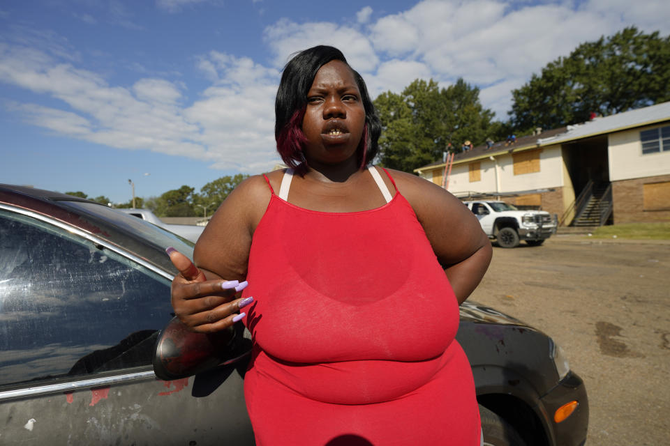 April Jackson stands outside her Jackson, Miss., apartment Oct. 5, 2022, and tells about the bureaucratic headaches she encountered as a single mother to collect a modest amount of Temporary Assistance for Needy Families (TANF) funds to help support her children who range in age from a few months to 13 years old. Funds from the program designed to help low-income families with children achieve economic self-sufficiency, were misspent and lawmakers are seeking to gain a better understanding of the welfare scandal. (AP Photo/Rogelio V. Solis)