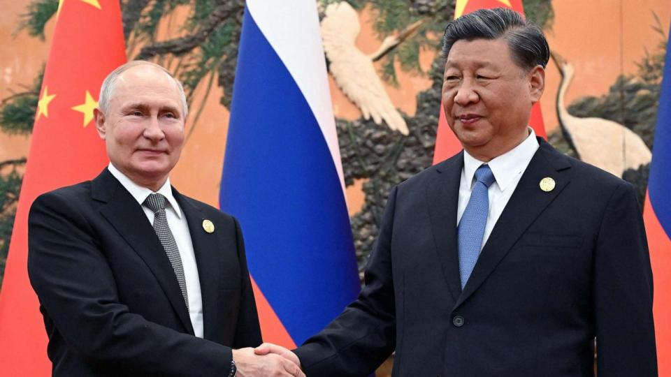 PHOTO: Russia's President Vladimir Putin and Chinese President Xi Jinping shake hands during a meeting in Beijing on Oct. 18, 2023. (Sergei Guneyev/POOL/AFP via Getty Images)