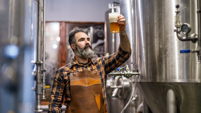 brewmaster holding beer