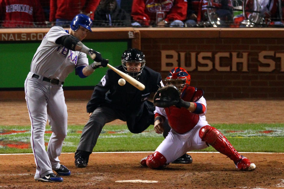 ST LOUIS, MO - OCTOBER 20: Josh Hamilton #32 of the Texas Rangers hits an RBI sacrifice fly ball to tie the game in the ninth inning during Game Two of the MLB World Series against the St. Louis Cardinals at Busch Stadium on October 20, 2011 in St Louis, Missouri. (Photo by Dilip Vishwanat/Getty Images)