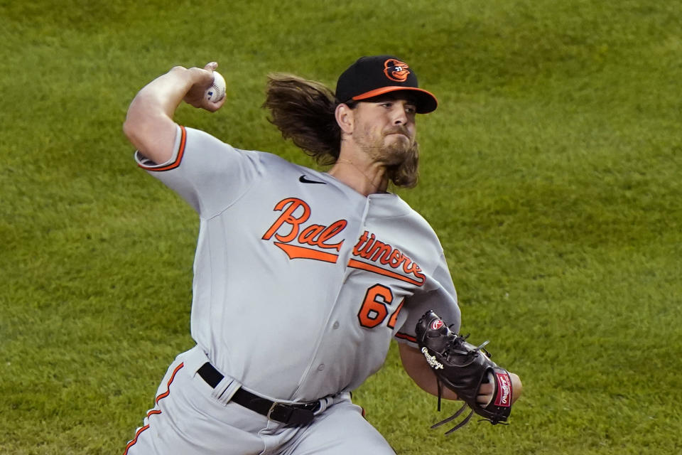 Baltimore Orioles starting pitcher Dean Kremer (64) winds up during the third inning of a baseball game against the New York Yankees, Tuesday, April 6, 2021, at Yankee Stadium in New York. (AP Photo/Kathy Willens)