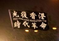 FILE PHOTO: A flag is seen amidst the rain during a rally at Edinburgh Place in Hong Kong