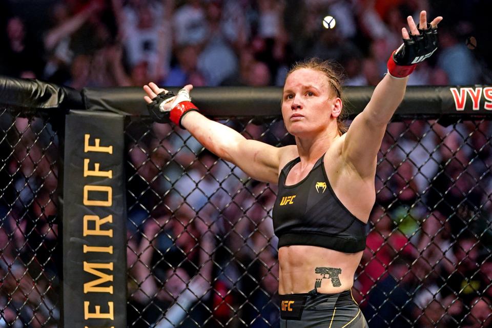 Valentina Shevchenko (red gloves) pumps up the crowd after defeating Jessica Andrade during UFC 261 at VyStar Veterans Memorial Arena on April 24, 2021 in Jacksonville. Mandatory Credit: Jasen Vinlove-USA TODAY Sports