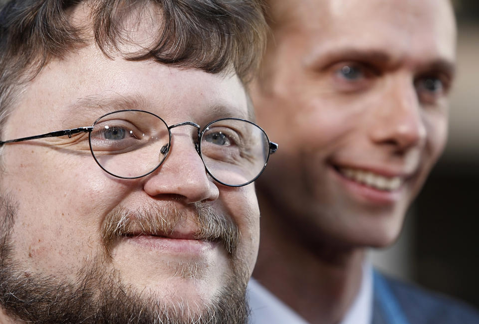 Writer and director Guillermo del Toro, left, and actor Doug Jones pose on the press line at the premiere of the feature film "Hellboy II: The Golden Army" in Los Angeles on Saturday, June 28, 2008. (AP Photo/Dan Steinberg)