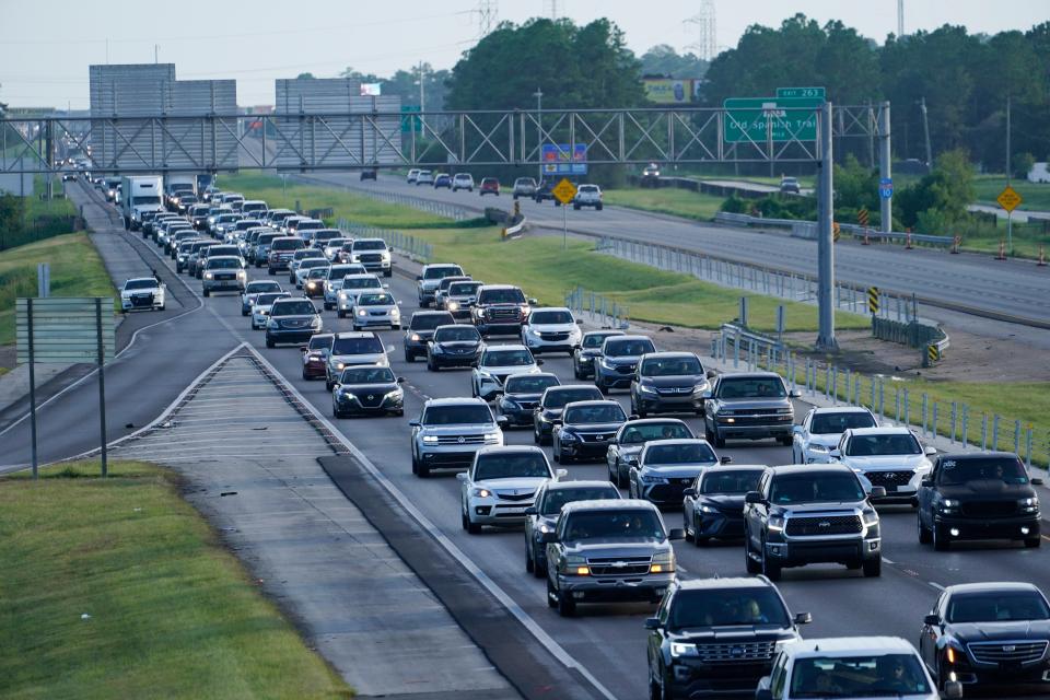 Heavy traffic clogs Interstate 10 out of New Orleans as residents and visitors evacuate (AP)