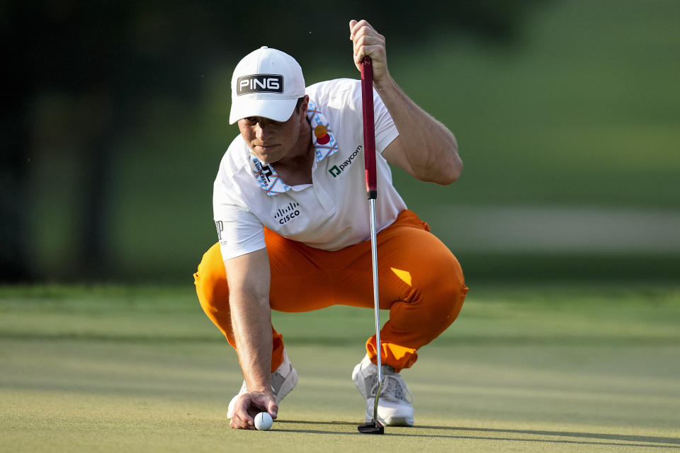 Viktor Hovland, of Norway, lines up a putt on the 13th green during the third round of the Tour Championship golf tournament, Saturday, Aug. 26, 2023, in Atlanta. (AP Photo/Mike Stewart)