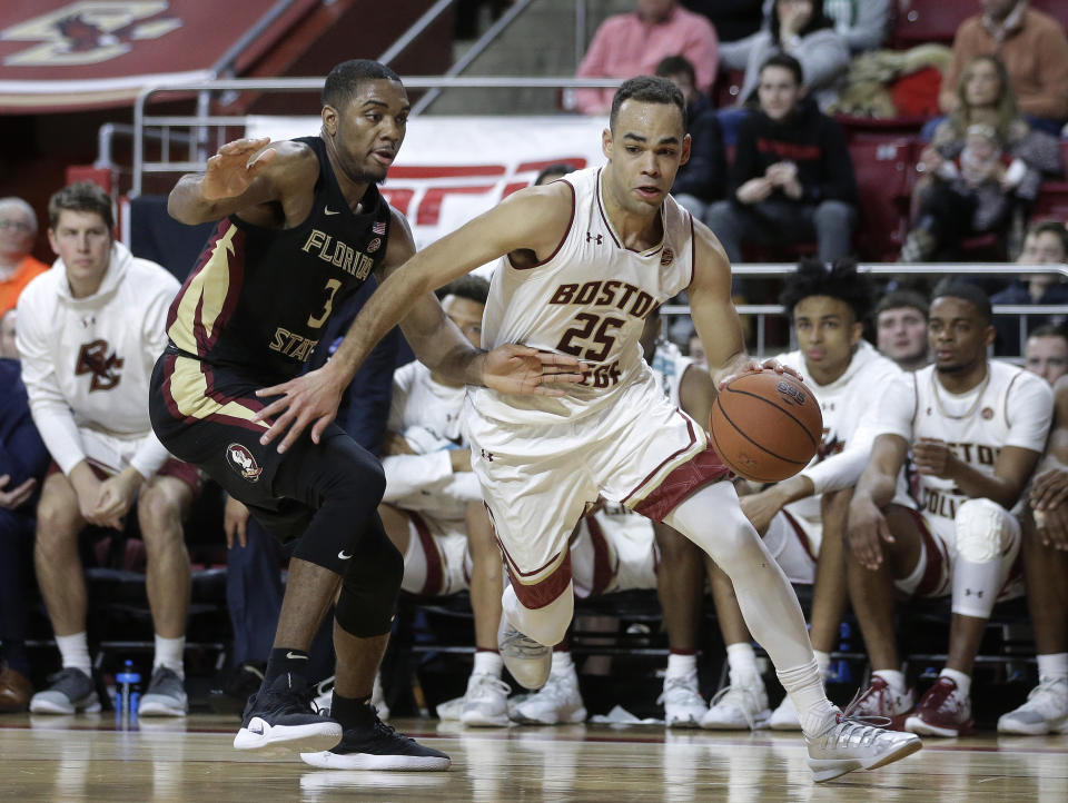 Florida State's Trent Forrest (3) tries to block Boston College's Jordan Chatman (25) in the second half of an NCAA college basketball game, Sunday, Jan. 20, 2019, in Boston. (AP Photo/Steven Senne)