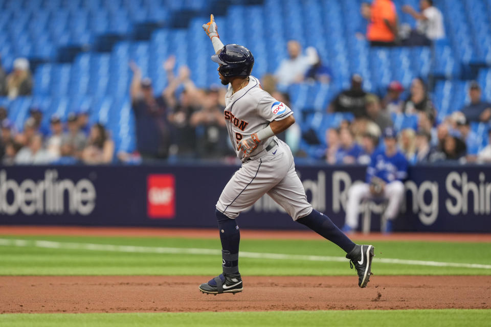 Houston Astros left fielder Corey Julks (9) celebrates his grand slam against the Toronto Blue Jays during the first inning of a baseball game, in Toronto, Monday, June 5, 2023. (Andrew Lahodynskyj/The Canadian Press via AP)