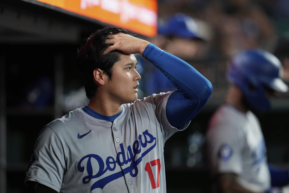 Los Angeles Dodgers' Shohei Ohtani walks through the dugout during the eighth inning of the team's baseball game against the San Francisco Giants, Friday, June 28, 2024, in San Francisco. (AP Photo/Godofredo A. Vásquez)