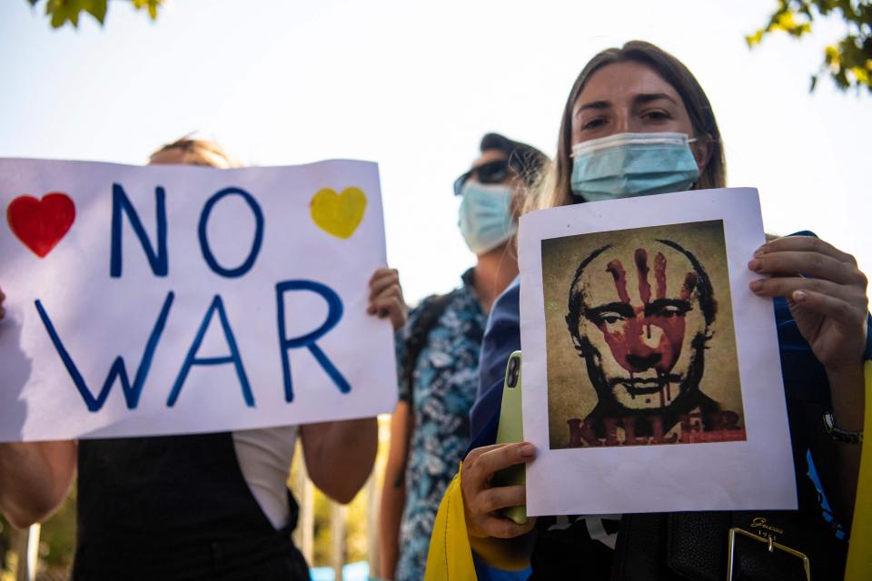 Ukrainian citizens protest in front of the Russian Embassy in Santiago, Chile, on Feb. 26, 2022.