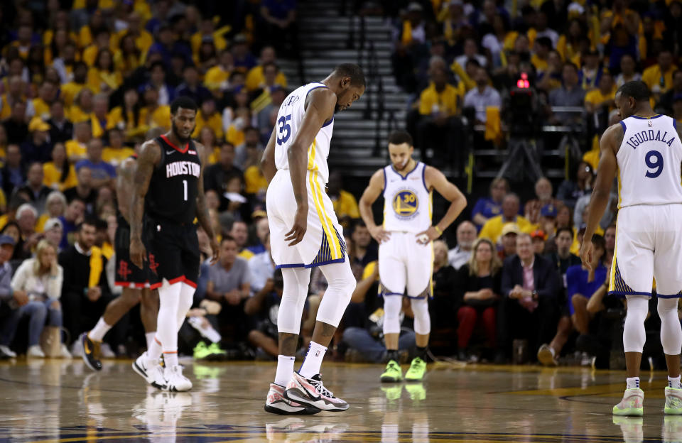 Kevin Durant of the Golden State Warriors walks off the court after injuring himself against the Houston Rockets during Game Five of the Western Conference Semifinals of the 2019 NBA Playoffs at ORACLE Arena on May 08, 2019 in Oakland, California.