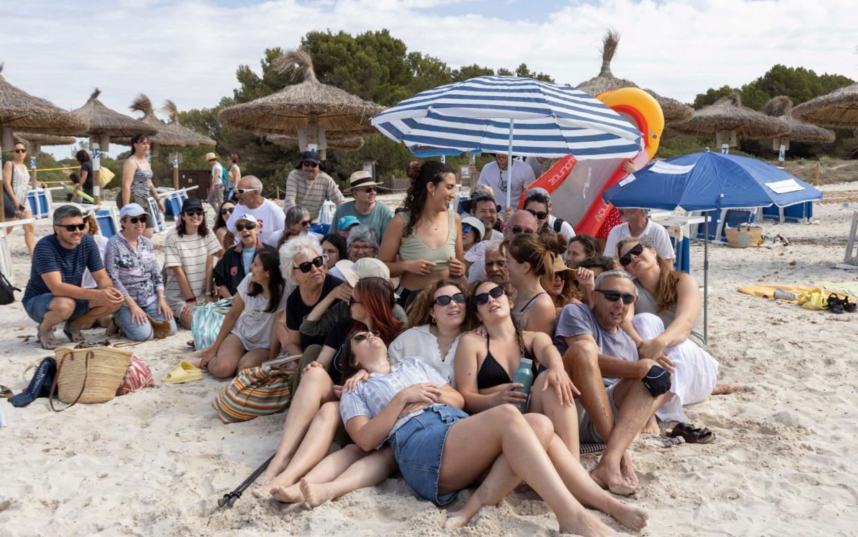 Protesters at Sa Rapita simulating a packed beach scenario