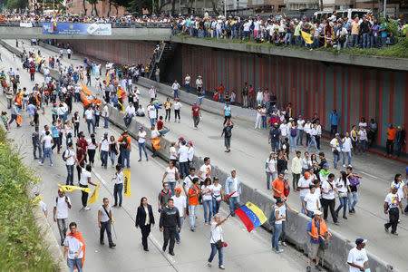 Opposition supporters take part in a rally against Venezuelan President Nicolas Maduro's government and to commemorate the 59th anniversary of the end of the dictatorship of Marcos Perez Jimenez in Caracas, Venezuela January 23, 2017. REUTERS/Carlos Garcia Rawlins