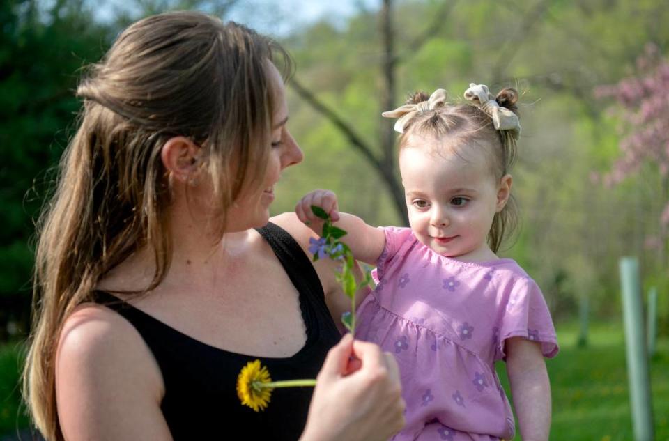 Freya Barragan picks dandelions and flowers with her mom Carly on Tuesday, April 30, 2024. Freya has Dravet Syndrome which causes seizures. Abby Drey/adrey@centredaily.com