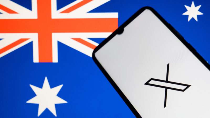 A smartphone with the logo for X (formerly Twitter) set against the Australian flag.