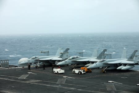 U.S. aircrafts are seen on the deck of USS Abraham Lincoln in the Gulf of Oman near the Strait of Hormuz