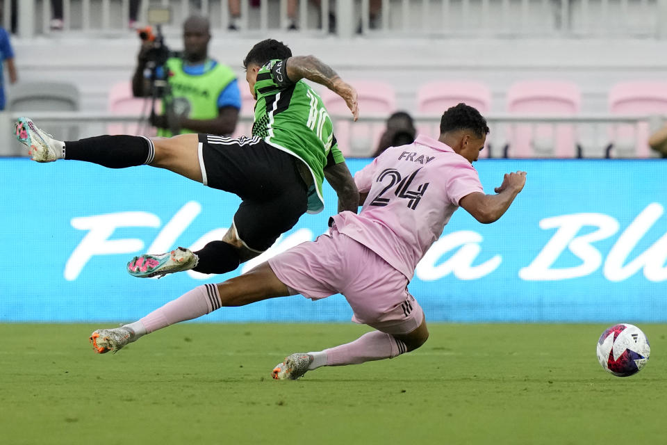 Austin FC forward Sebastián Driussi (10) and Inter Miami defender Ian Fray (24) go for the ball during the first half of an MLS soccer match, Saturday, July 1, 2023, in Fort Lauderdale, Fla. (AP Photo/Lynne Sladky)