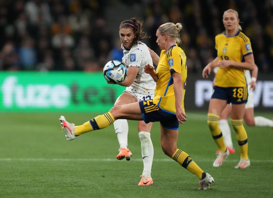 USWT forward Alex Morgan (13) and Sweden defender Jonna Andersson (2) battle for control of the ball during their Round of 16 match at the 2023 World Cup in Melbourne, Australia.
