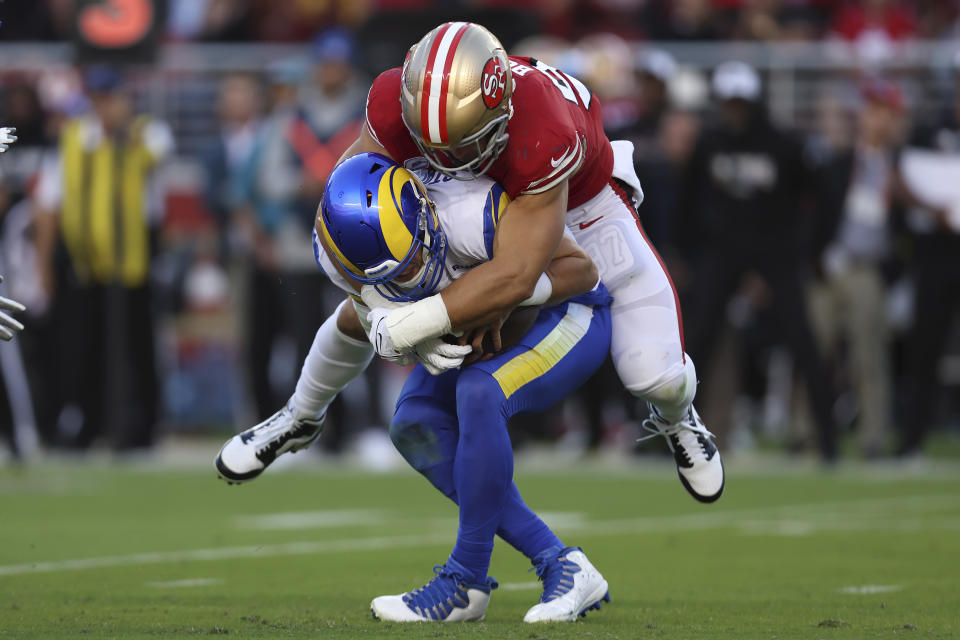 San Francisco 49ers defensive end Nick Bosa, top, sacks Los Angeles Rams quarterback Matthew Stafford during the first half of an NFL football game in Santa Clara, Calif., Monday, Oct. 3, 2022. (AP Photo/Jed Jacobsohn)