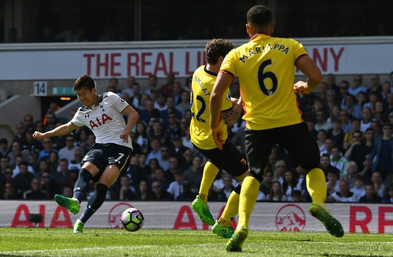 Tottenham Hotspur's Son Heung-Min (L) scores his team's fourth, and his second goal during their match against Watford at White Hart Lane in London, on April 8, 2017