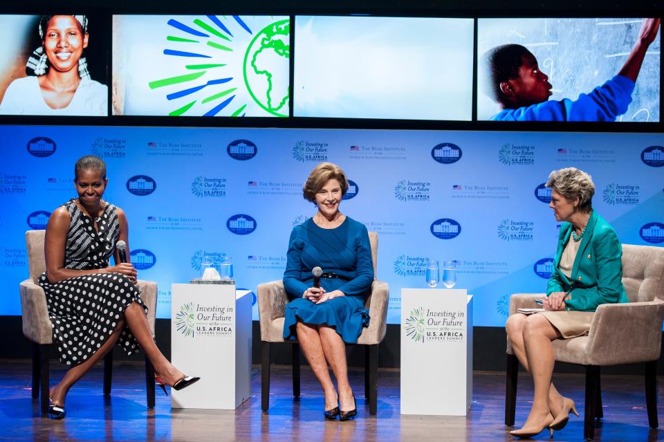 WASHINGTON, DC - AUGUST 6:  Former first lady Laura Bush (C), U.S. first lady Michelle Obama (L) and journalist Cokie Roberts participate in a Spousal Symposium at the John F. Kennedy Center for the Performing Arts on August 6, 2014 in Washington, DC. The symposium, sponsored by first lady Michelle Obama and former first lady Laura Bush, focuses on the role the spouses of world leader's play and the impact of investments in education, health, and economic development through public-private partnerships. (Photo by Pete Marovich/Getty Images)