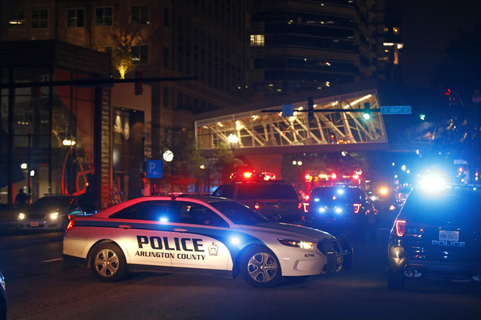 Law enforcement officials respond to reports of a shooting at Ballston Quarter mall in Arlington, Va., Saturday, Sept. 14, 2019. Authorities said they have found no evidence that a shooting occurred at a movie theater that is part of the mall. Reports of a shooting had prompted panic and a large police presence Saturday night. (AP Photo/Patrick Semansky)
