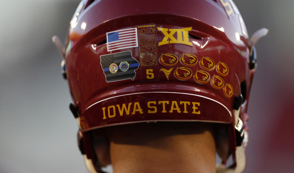 Iowa State wide receiver Allen Lazard wears a decal on his helmet honoring two Des Moines-area police officers that were killed early Wednesday morning before an NCAA college football game against Oklahoma, Thursday, Nov. 3, 2016, in Ames, Iowa. (AP Photo/Charlie Neibergall)