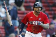 Boston Red Sox's Xander Bogaerts tosses his bat after hitting a three-run home run during the fifth inning of a baseball game against the Los Angeles Angels, Saturday, May 15, 2021, in Boston. (AP Photo/Michael Dwyer)