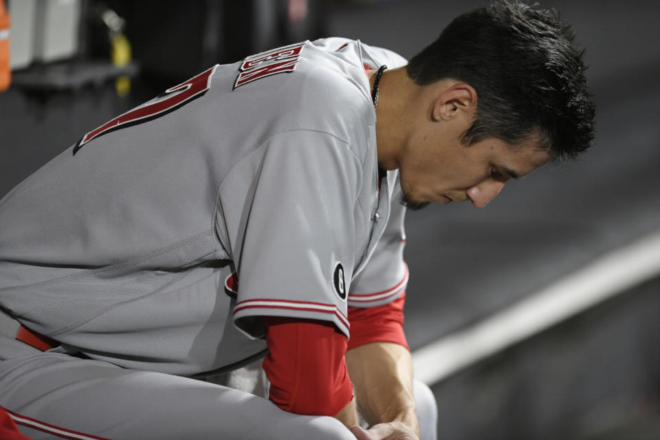 Cincinnati Reds starting pitcher Riley O'Brien reacts in the dugout after being pulled during the second inning of his major league debut in a baseball game against the Chicago White Sox Tuesday, Sept. 28, 2021, in Chicago. (AP Photo/Paul Beaty)