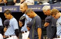 <p>Members of the Tampa Bay Rays pause for a moment of silence for Miami Marlins pitcher Jose Fernandez prior to their game against the Boston Red Sox at Tropicana Field on September 25, 2016 in St. Petersburg, Florida. (Photo by Joseph Garnett Jr. /Getty Images) </p>