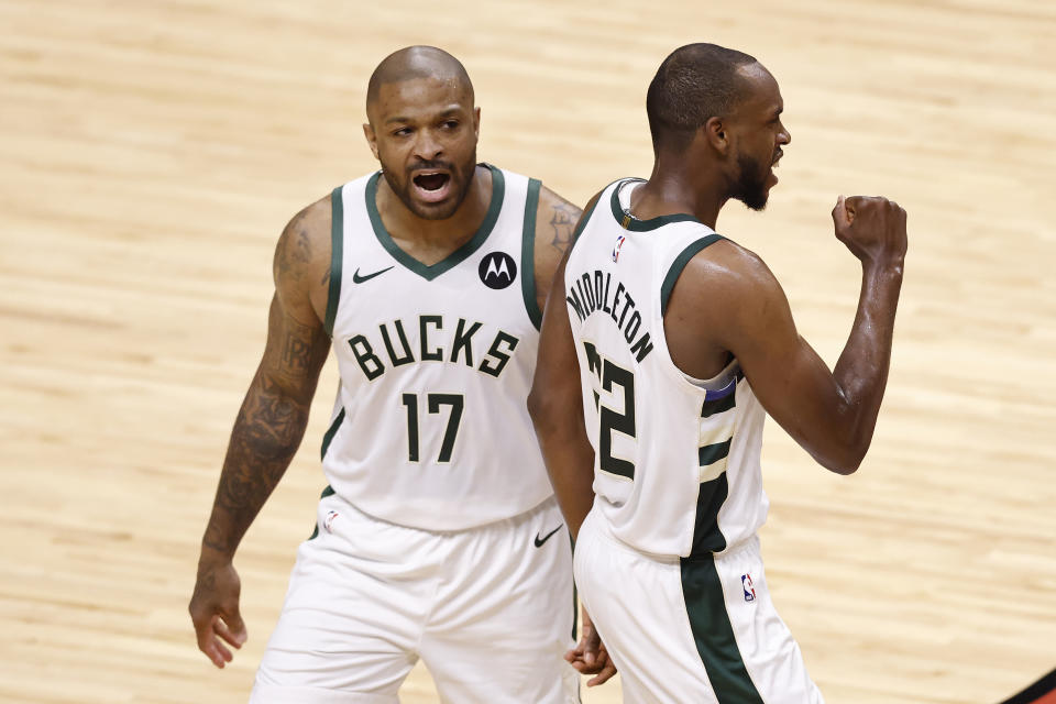 MIAMI, FLORIDA - MAY 27: P.J. Tucker #17 and Khris Middleton #22 of the Milwaukee Bucks celebrate against the Miami Heat during the third quarter in Game Three of the Eastern Conference first-round playoff series at American Airlines Arena on May 27, 2021 in Miami, Florida. NOTE TO USER: User expressly acknowledges and agrees that, by downloading and or using this photograph, User is consenting to the terms and conditions of the Getty Images License Agreement. (Photo by Michael Reaves/Getty Images)