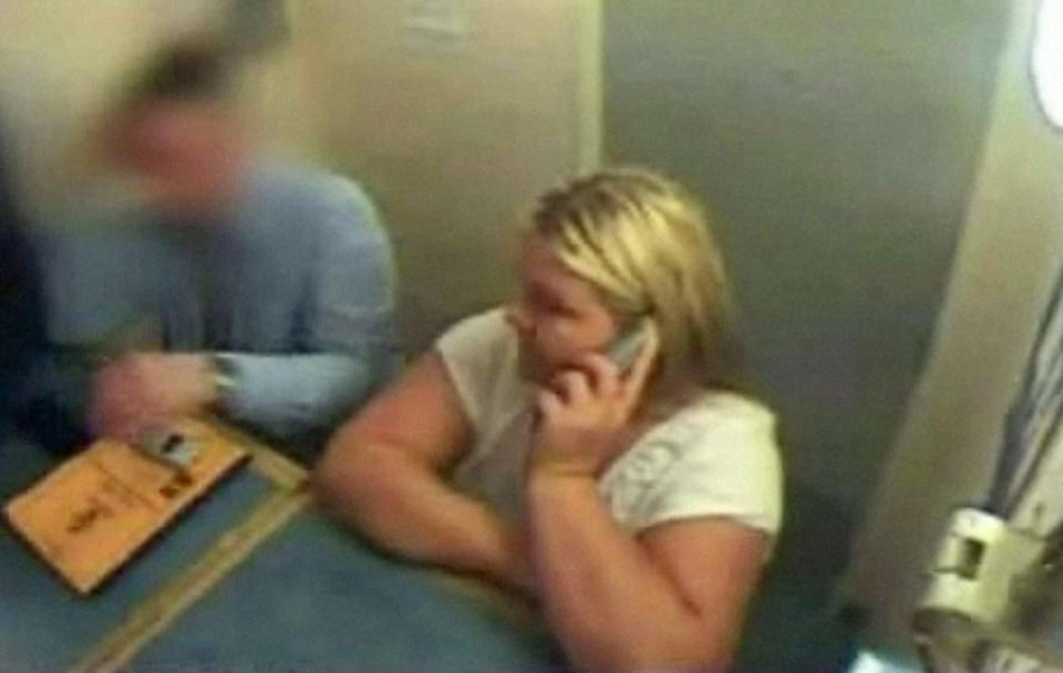 Undated Devon and Cornwall Police undated CCTv footage of Vanessa George on the phone to her lawyer while in police custody in Plymouth. 