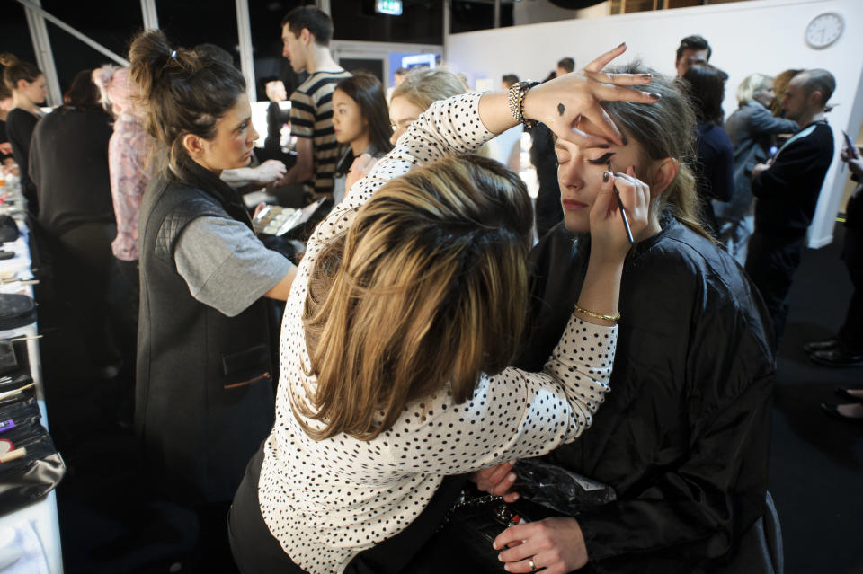 A model is prepared ahead of the Zoe Jordan collection during London Fashion Week, Friday, Feb. 15, 2013, in London. (Photo by Jonathan Short/Invision/AP)