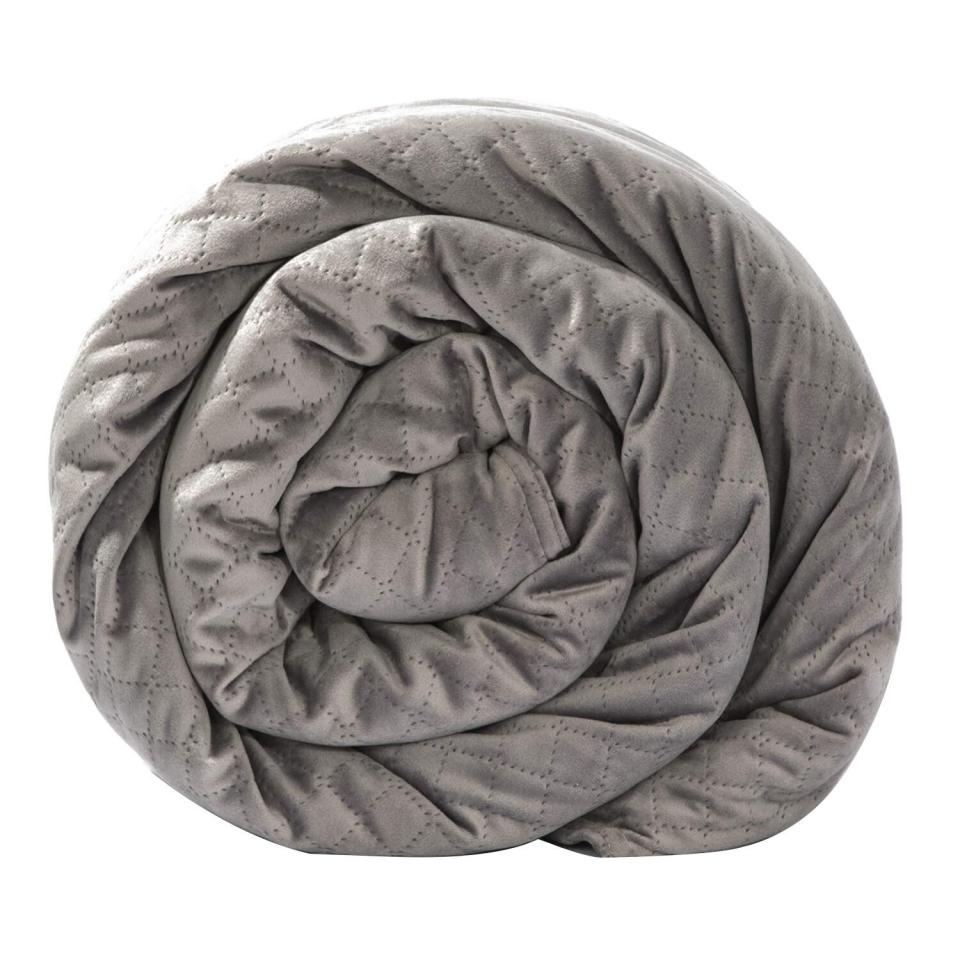 <a href="https://www.huffpost.com/entry/weighted-blanket-amazon-review_l_5cad1253e4b01bf96006fc5f"><strong>Weighted blankets</strong></a> have become known as a remedy for sleeplessness and anxiety. The extra weight of the blanket has been shown to lower stress and anxiety levels because it stimulates the feeling of being hugged. <strong><a href="https://amzn.to/2pqlRHK" target="_blank" rel="noopener noreferrer">The BlanQuil Premium Weighted Blanket</a></strong> has a removable (and washable!) ultra-soft micro plush cover. Choose from a variety of colors and weights for a custom fit for your pal. <strong><a href="https://amzn.to/2pqlRHK" target="_blank" rel="noopener noreferrer">Get it on Amazon</a></strong>.