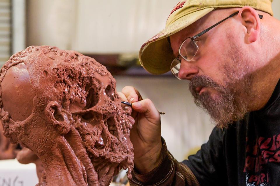 Jonathan Thornton works on the details of a clay model at his Montgomery studio.