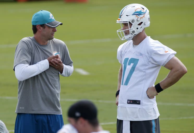 Adam Gase working with Ryan Tannehill (AP)