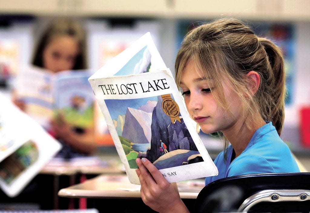 Port Washington Elementary third grader Lindsay Wrather reads a book in Beccie Booth’s classroom in this file photo.