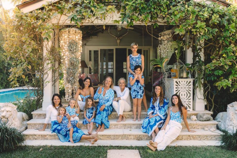 Minnie and Liza Pulitzer (center) are surrounded by their children and grandchildren, all of whom are wearing pieces from the new Barefoot in Paradise collection from Lilly Pulitzer.