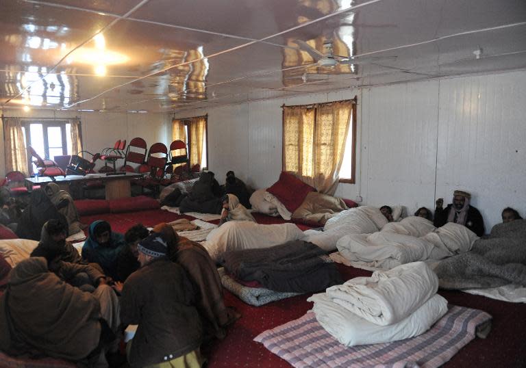 Stranded truck drivers from Pakistan-administered Kashmir rest in a room used as their sleeping quarters at the Trade Facilitation Centre at Salambad in Uri, some 115 kilometres from Srinagar, on January 21, 2014