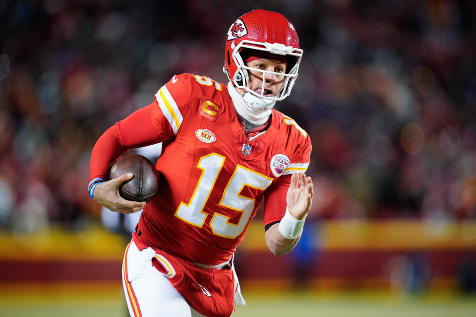 Jan 13, 2024; Kansas City, Missouri, USA; Kansas City Chiefs quarterback Patrick Mahomes (15) runs the ball against the Miami Dolphins during the first half of the 2024 AFC wild card game at GEHA Field at Arrowhead Stadium. Mandatory Credit: Jay Biggerstaff-USA TODAY Sports